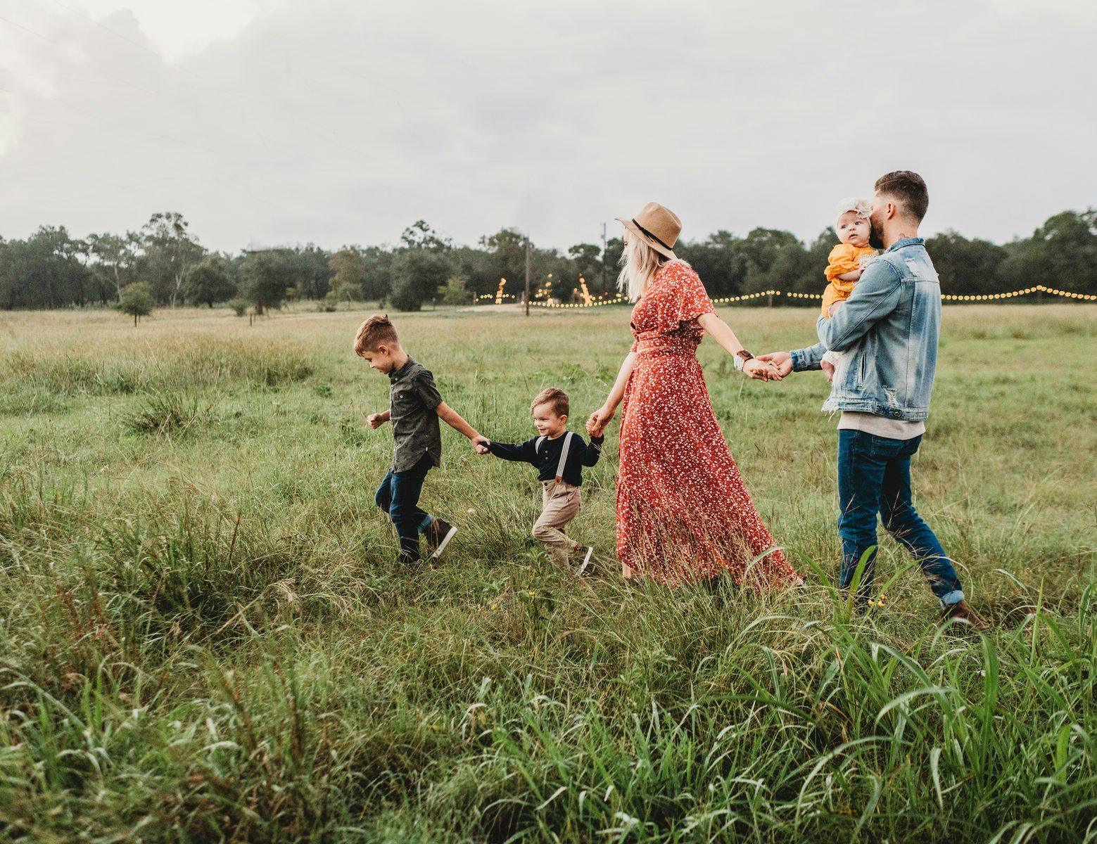 Family of five walking outdoors after reviewing how an income change affects their 2027 ACA premium