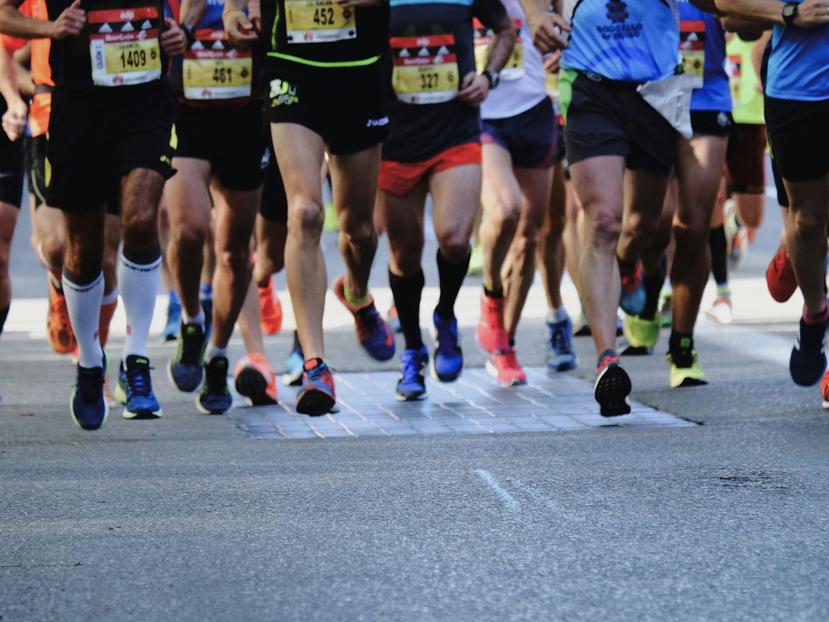 Runners in motion, illustrating the health standards behind passing a DOT physical