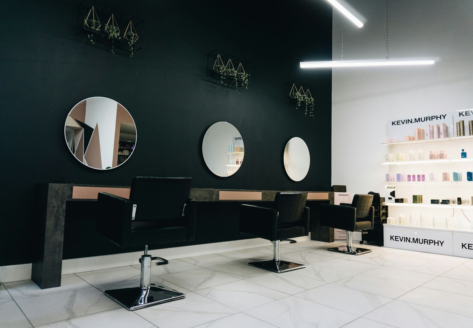 Salon interior with styling stations, a business covered by group health insurance