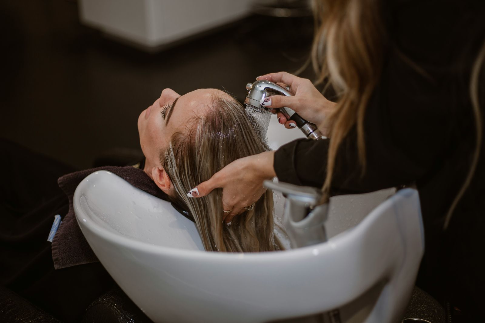 Salon owner reviewing affordable group health plans for staff