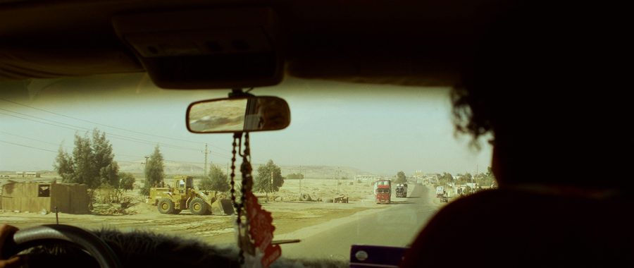 Semi truck crossing a state line on the highway